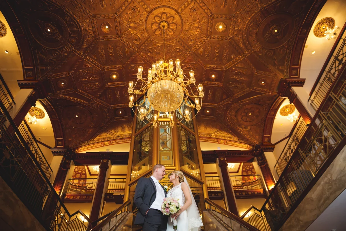 Luxury Providence wedding portrait under a chandelier